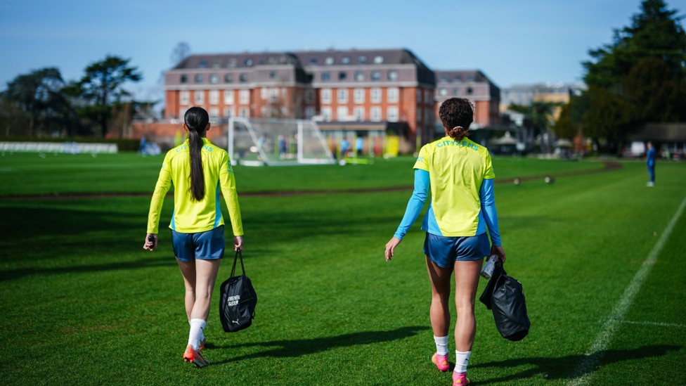 HERE WE GO : Lily Murphy and Mary Fowler make their way out for the session