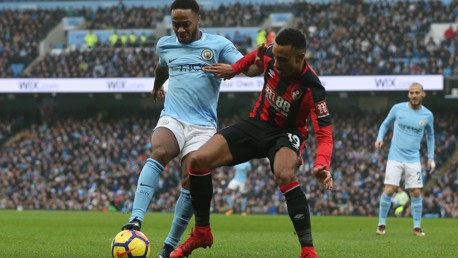 IN BATTLE: Raheem Sterling shields the ball from Bournemouth's Junior Stanislas.