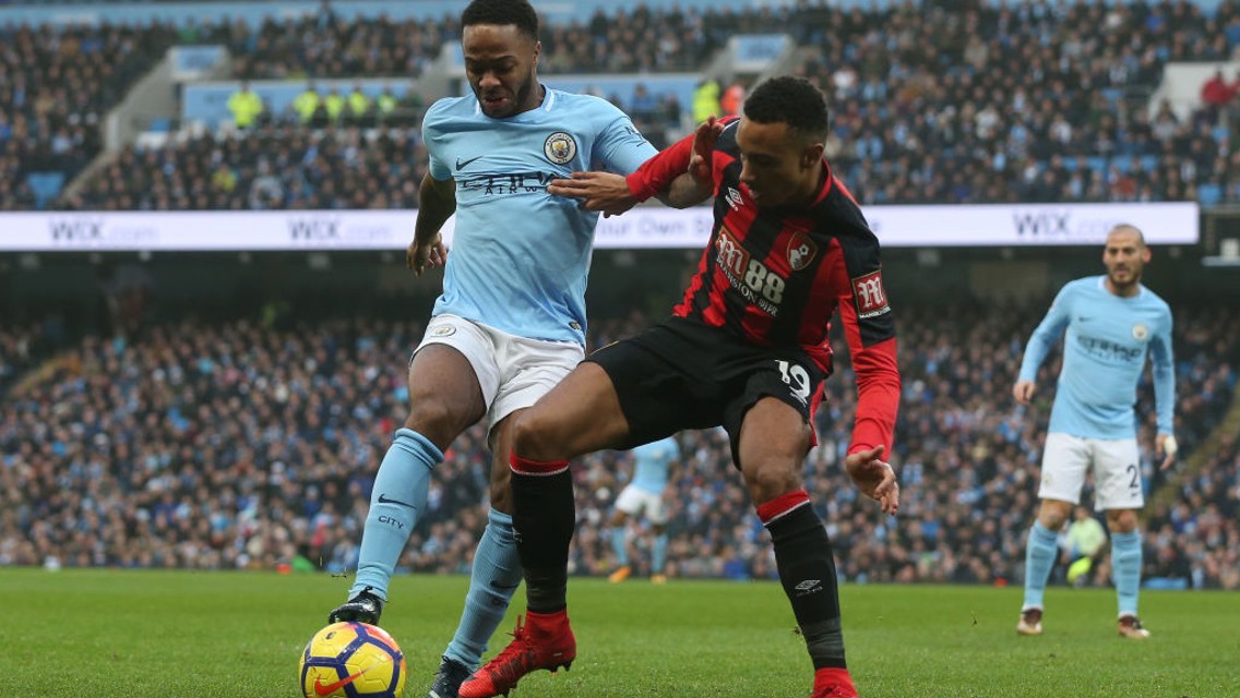 IN BATTLE: Raheem Sterling shields the ball from Bournemouth's Junior Stanislas.