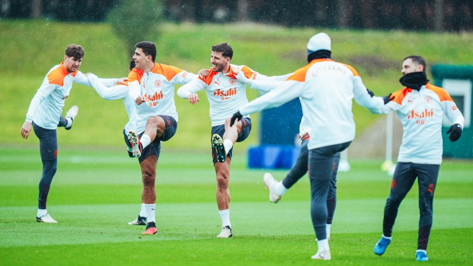 CAN-DO ATTITUDE  : City's players limber up.