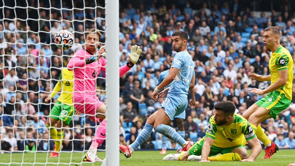 DEADLOCK BROKEN : Gabriel Jesus' vicious cross is bundled into the Norwich net by Grant Hanley