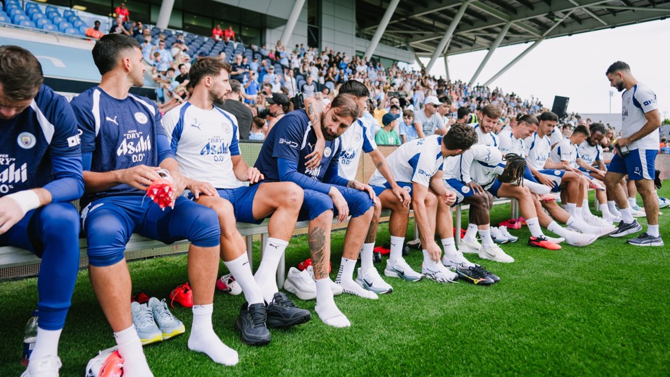 LACING UP : The team put on their boots.