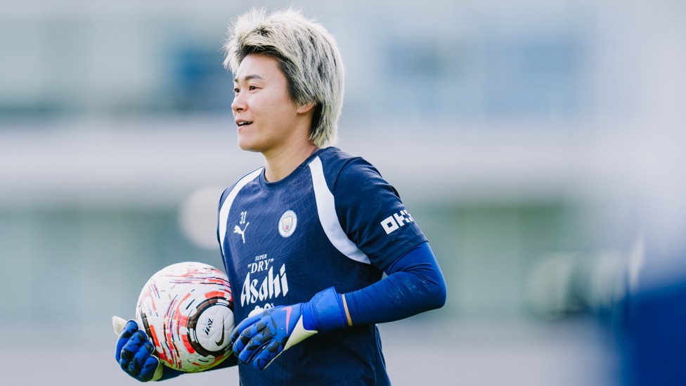 SAFE HANDS: Ayaka Yamashita cradles the ball under her arm
