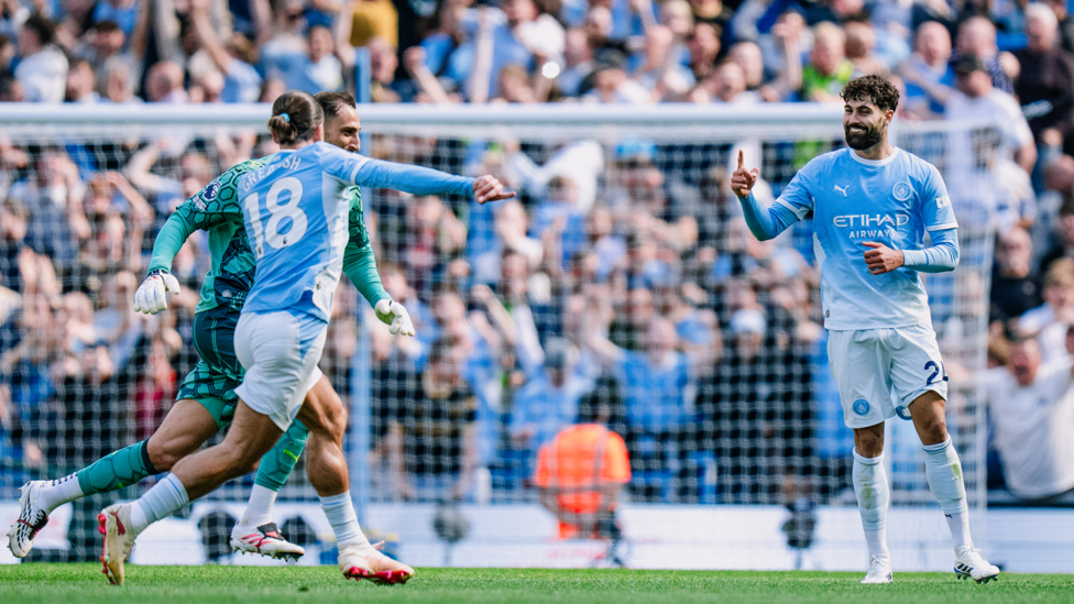 OH YES: Jack Grealish celebrates with match winner Gvardiol.