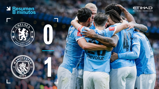 An image displaying the final score of a football match between Chelsea and Manchester City with Chelsea 0 and Manchester City 1. The image includes Manchester City players celebrating together.