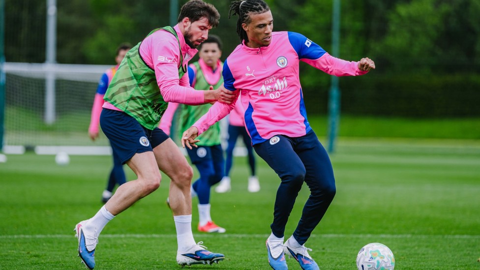 HEAD TO HEAD : Ruben Dias and Nathan Ake compete for possession