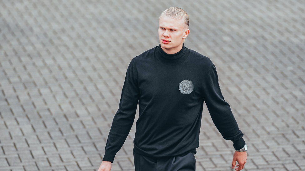 ICE COOL : Haaland keeps warm as he heads towards the plane