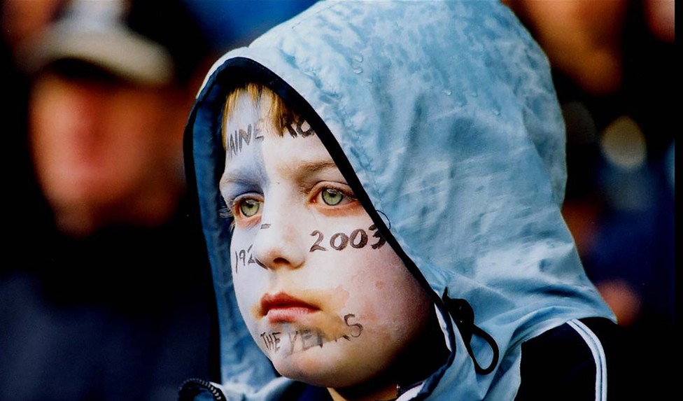 TIME TO REFLECT: This young fan takes in the emotional scenes