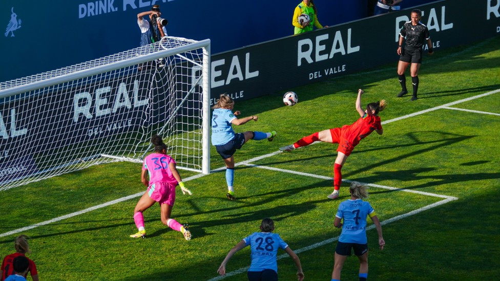 LAST GASP : Laura Wienroither clears off the line