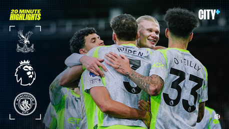 Manchester City players celebrating during a Premier League match against Crystal Palace, with 'No Room for Racism' logo visible and kits showing players Ruben and O'Reilly.