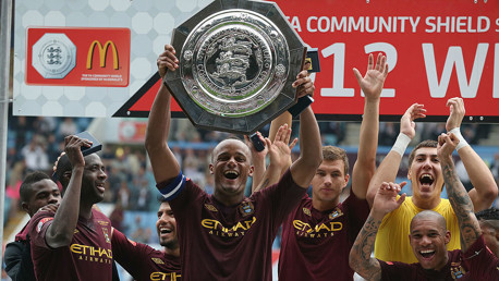 ALL SMILES: Vincent Kompany lifts the Community Shield as City celebrate after our 3-2 victory over Chelsea in 2012