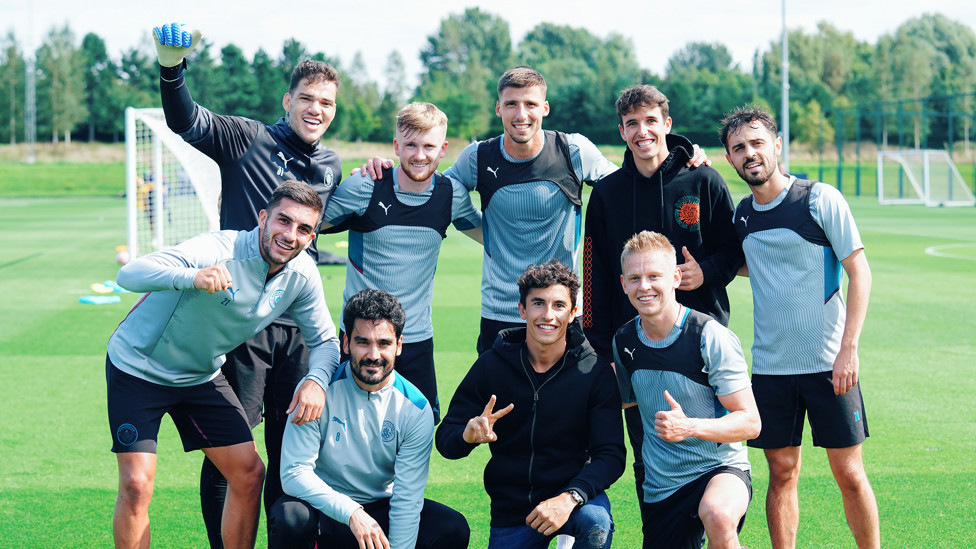 MAN MARQING : Alex and Marc have a photo with some of the lads