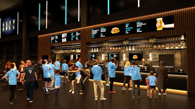 People in light blue jerseys lining up at a bar counter with a digital menu above, labeled 'CITY BAR', and a 'CITY HALL' sign in the background.