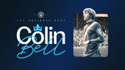A tribute to Colin Bell, labeled as 'The Unlikely Hero.' The image includes a vintage football player with number 8 jersey, Manchester City logo, and decorative text.