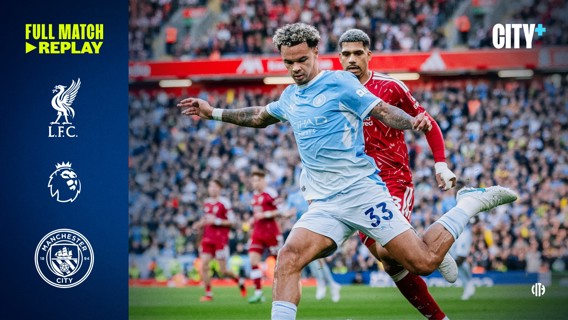 Football match action between Liverpool and Manchester City in the Premier League, featuring players in motion on the field. Logos for Liverpool, Manchester City, Premier League, and City+ displayed on the sides.