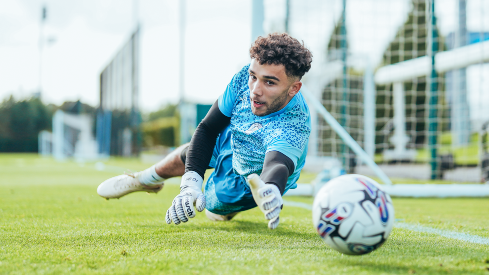 AT FULL STRETCH: Goalkeeper True Grant dives to his left