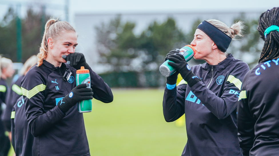 DRINK BREAK : Esme Morgan and Alanna Kennedy refuel for the next drill