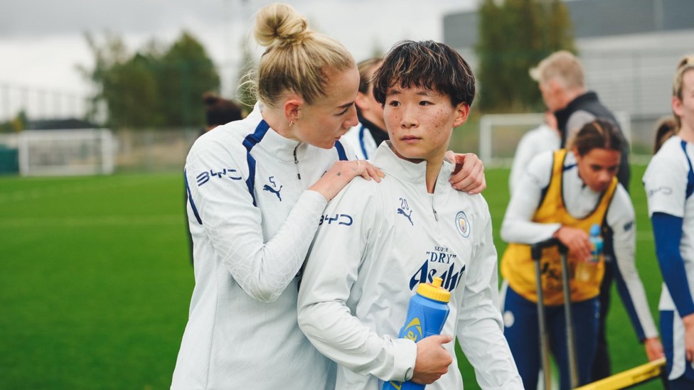 CAPTAIN'S CALL: Alex Greenwood shares a tip with Aoba Fujino.