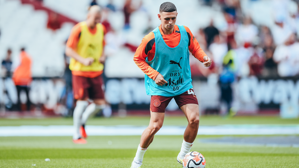 PHIL-ING GOOD : Foden gets in the mood during the pre-match warm up.