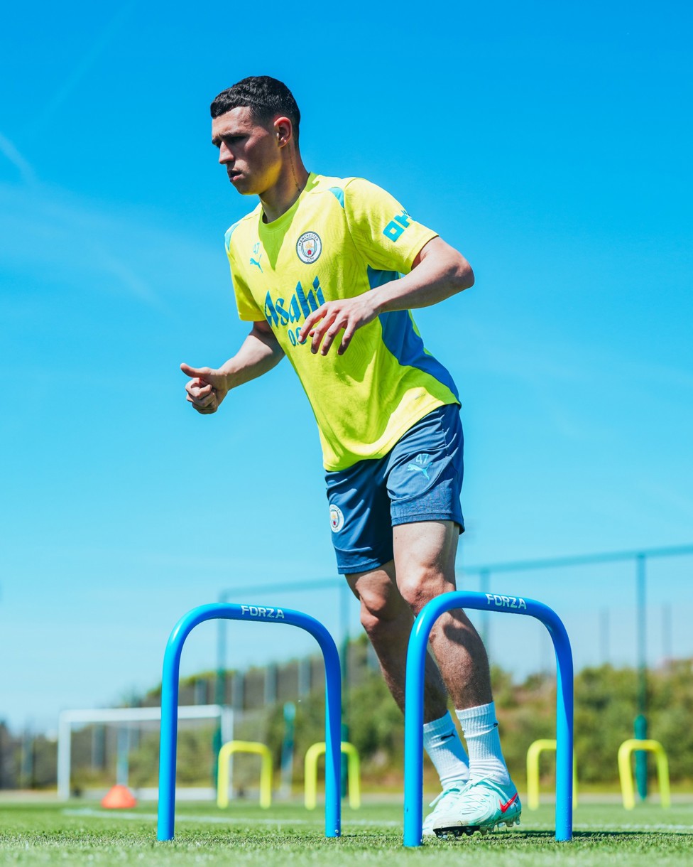 WARMING UP : Phil Foden works his way through the gates