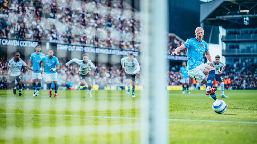 ON THE SPOT : Haaland strokes in from 12 yards.