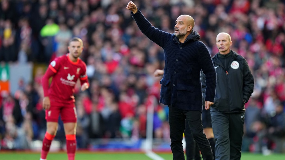 PEP TALK: The boss passes on instructions from the touchline.