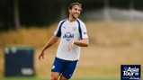 Manchester City football player in training wearing a jersey with 'Asia Tour '26' logo.
