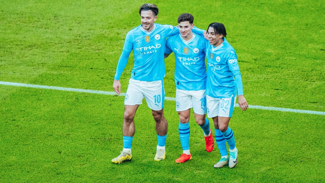 TERRIFIC TRIO: Lewis and Grealish celebrate with Alvarez.