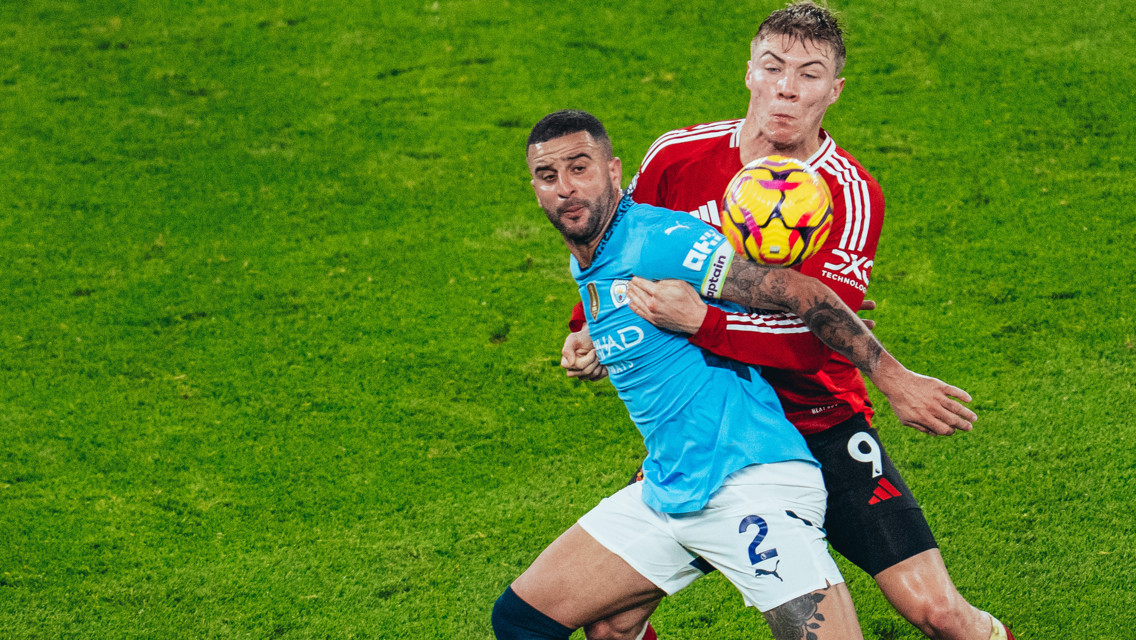 BATTLE: Walker and Hojlund tussle for possession.