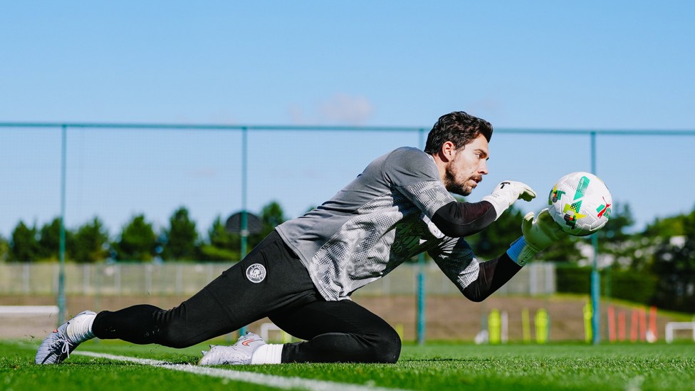 DOWN LOW : Stefan Ortega Moreno catches a low driven shot. 