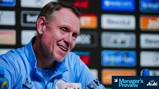 A press conference setting featuring a person in a Manchester City top with sponsor logos in the background. Text reading 'Manager's Preview' is present.