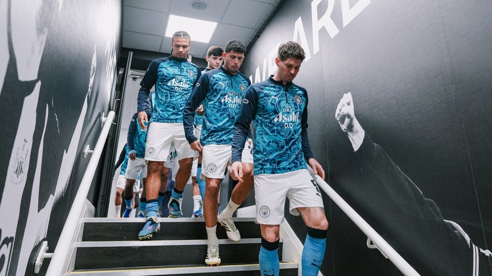 READY TO GO: John Stones leads the team pitchside
