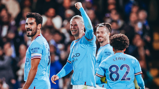 ALL SMILES: The players show their delight.