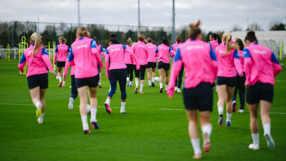 TOGETHER AGAIN : The squad head out on to the pitch in unison