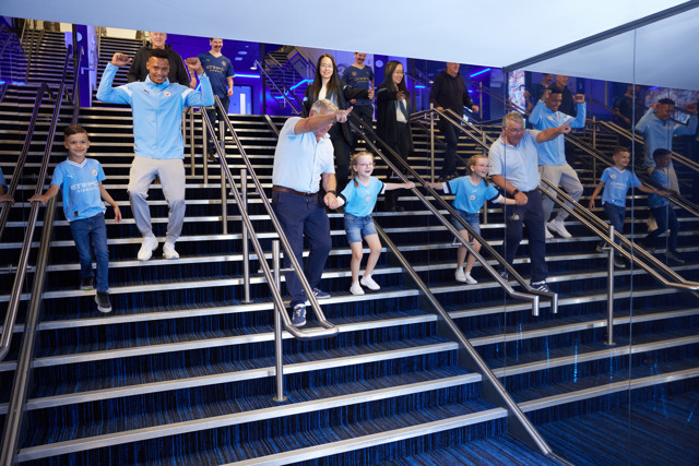 Fans walking down the stairs of the Tunnel 