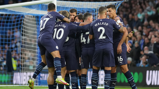 GROUP HUG: The players gather to celebrate Gundogan's goal.