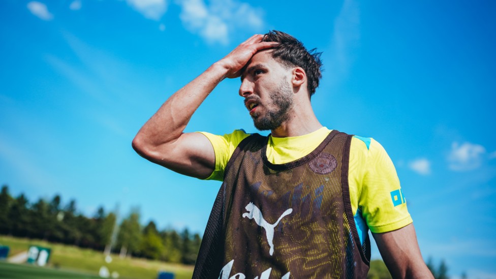 BREATHER: Ruben Dias takes a quick break as City prepare for the next task in hand.