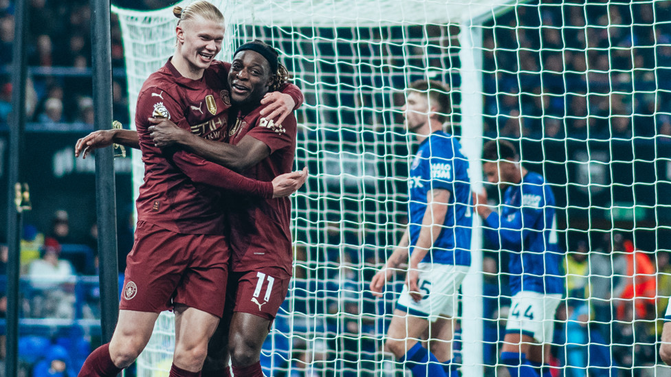 HAALAND HUG : Our number nine shares the love with Doku.