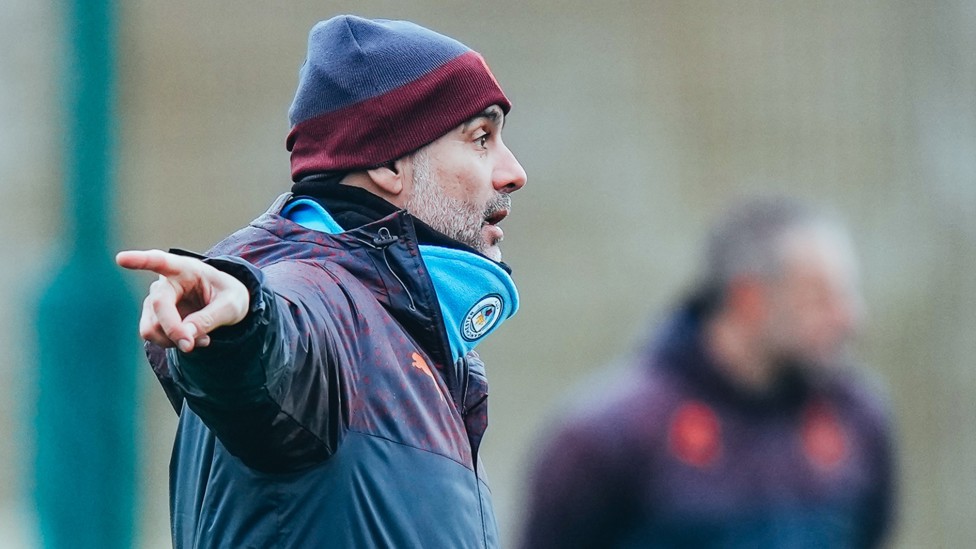 THIS WAY! : Our on the pitch, Pep Guardiola offers instructions during the drill. 
