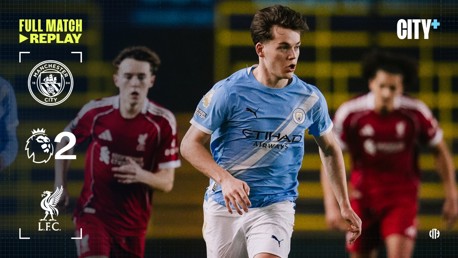 Replay image showing a Manchester City player in blue kit and Liverpool players in red kit. The score is 2-2 in a Premier League match. The City+ logo is visible.