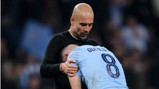 AGONY: Pep Guardiola consoles Ilkay Gundogan after the final whistle