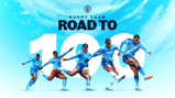 Image showing multiple blurred figures in Manchester City kits and text reading 'Bunny Shaw Road to 100' against a sky blue background.