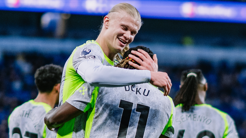 HAALAND HUG : Erling celebrates with the goalscorer.