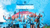 Manchester City Women's team celebrating their 2025/26 Barclays Women's Super League championship win with confetti in the background.