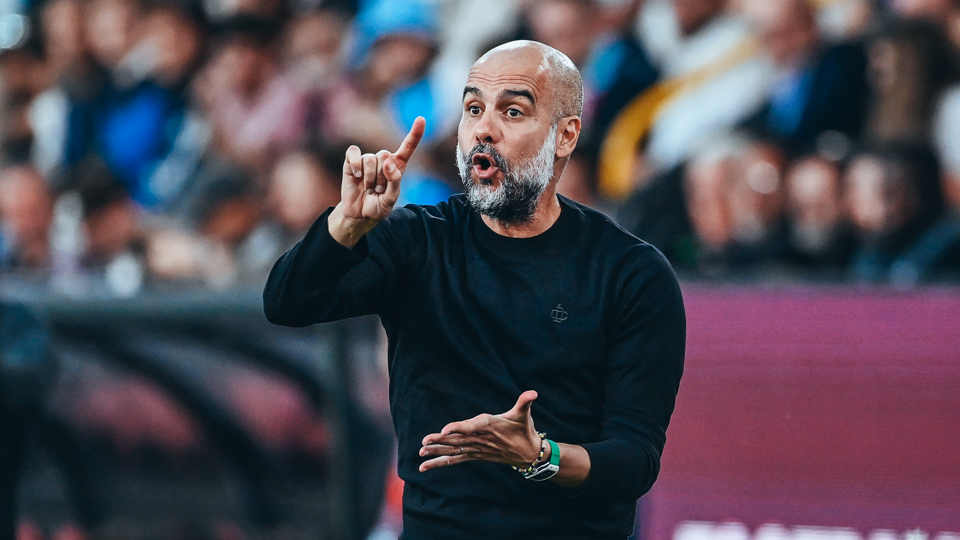 POINTING THE WAY: Pep Guardiola passes on instructions.