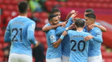 ON THE MARK: Kyle Walker is mobbed by his City team-mates after breaking the deadlock