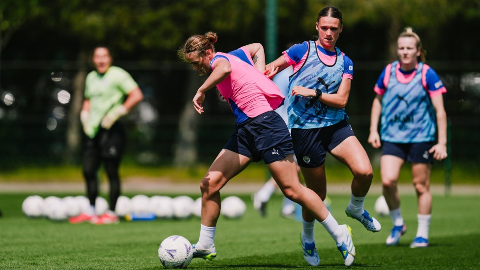 HEAT OF BATTLE : Grace Clinton and Kerstin Casparij fight for the ball