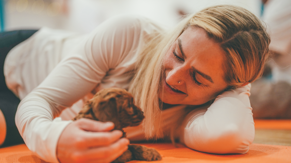 HELLO THERE : Laura Coombs all-smiles as she meets a Toy Cockapoo