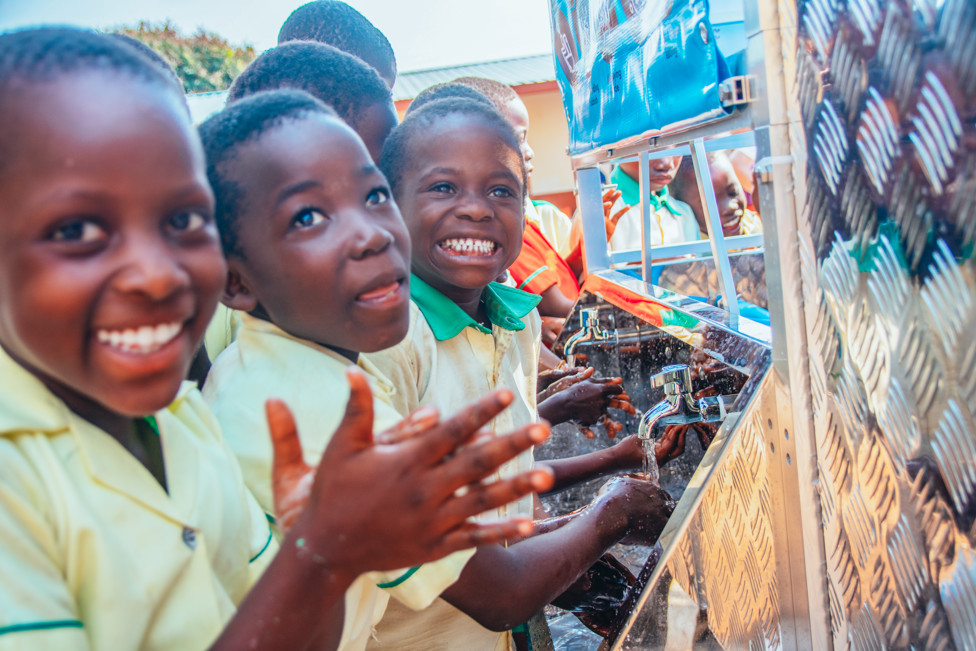 Children enjoying learning the handwashing steps at the new tower 