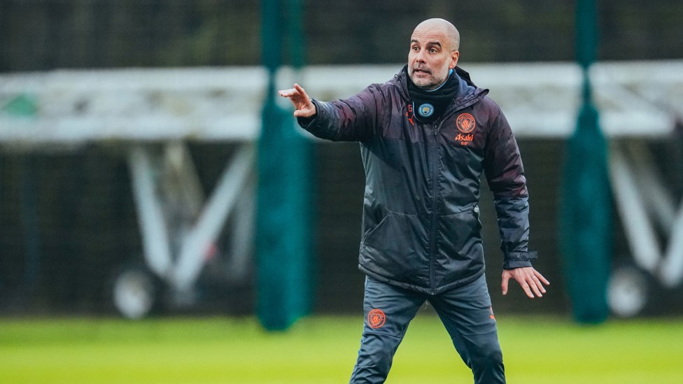 MAKING A POINT : Pep Guardiola takes charge